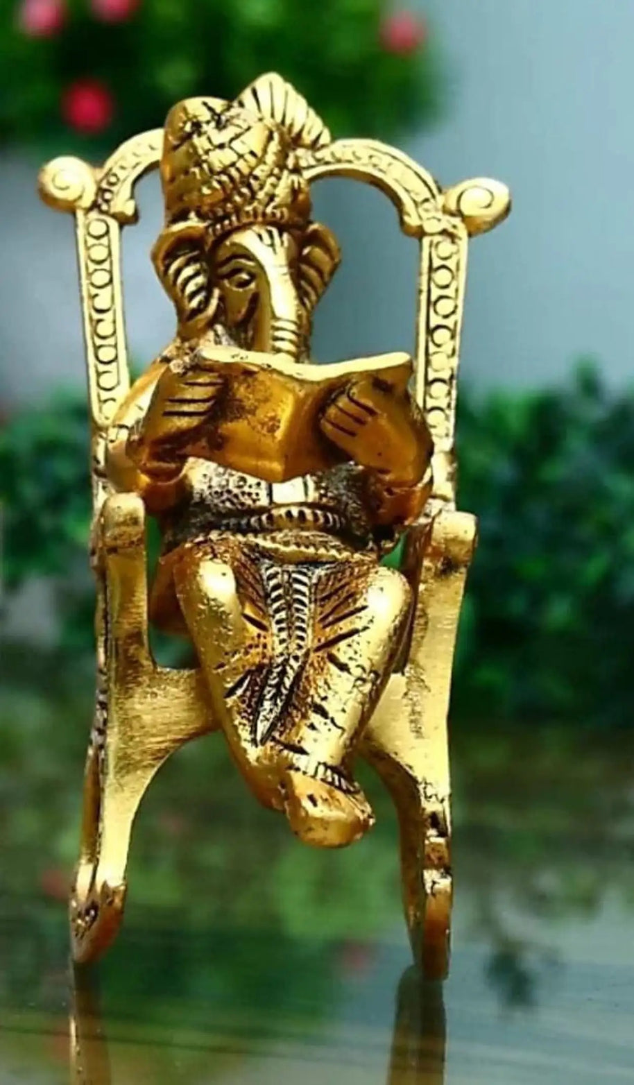 Brass 3D Moving Lord Ganesha Statue Sitting on A Chair and Reading Ramayan